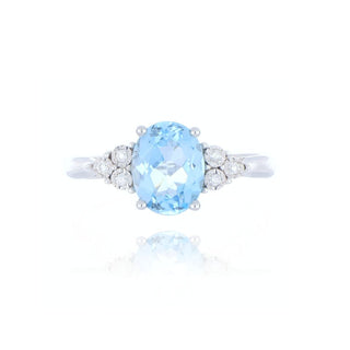 9ct white gold blue topaz and diamond 3 stone style ring